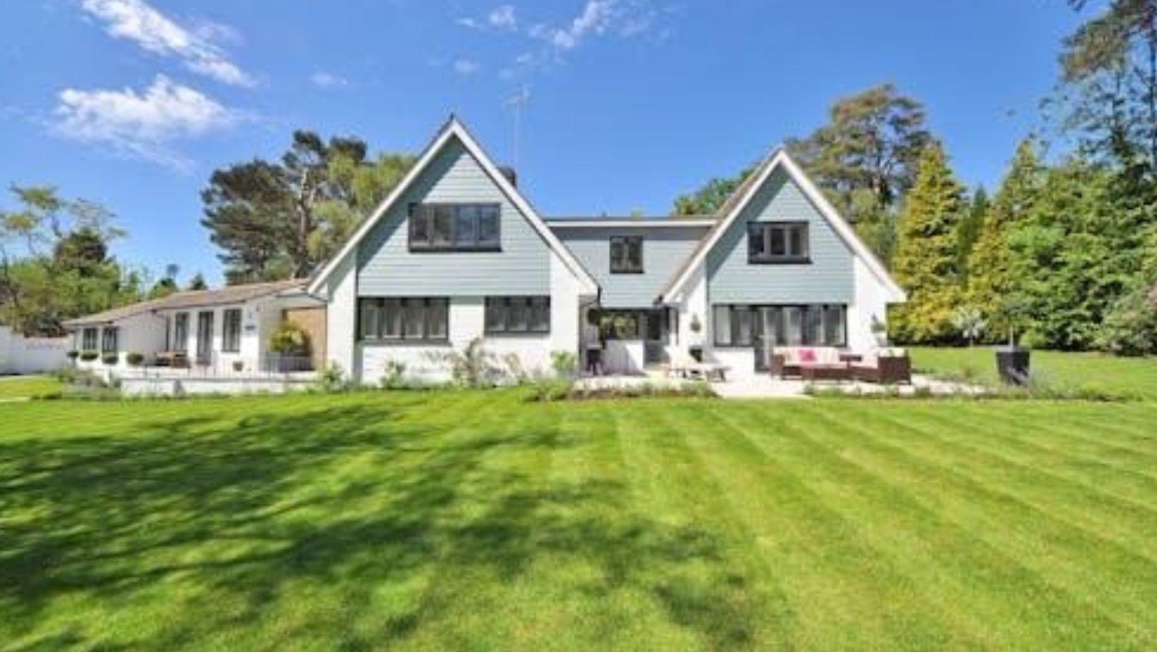 How do well planned gardens improve home aesthetics