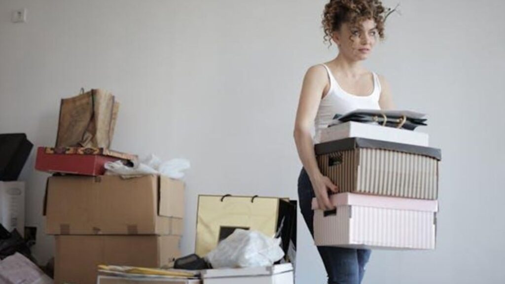 woman carrying boxes