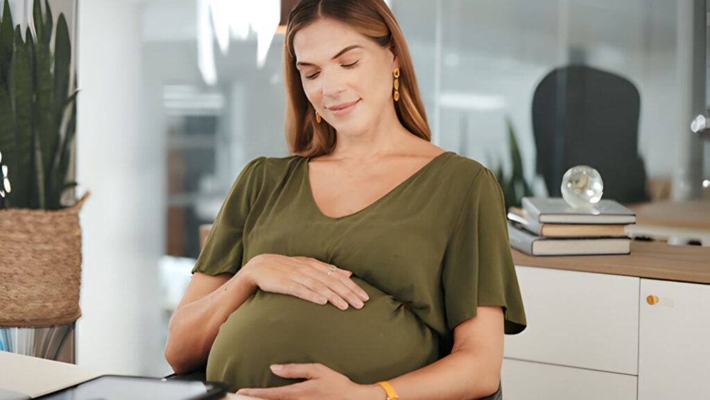 Pregnant woman in office.