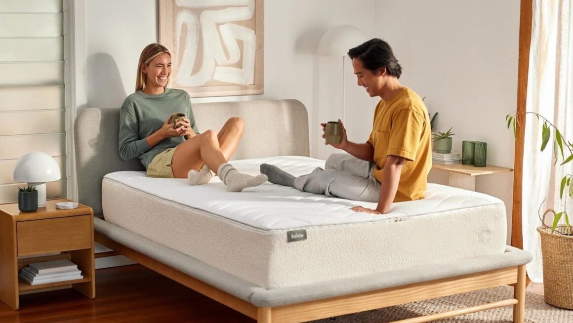 Couple relaxing on bed with coffee.