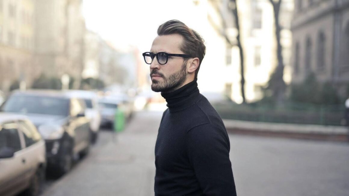 Stylish man in glasses on street.